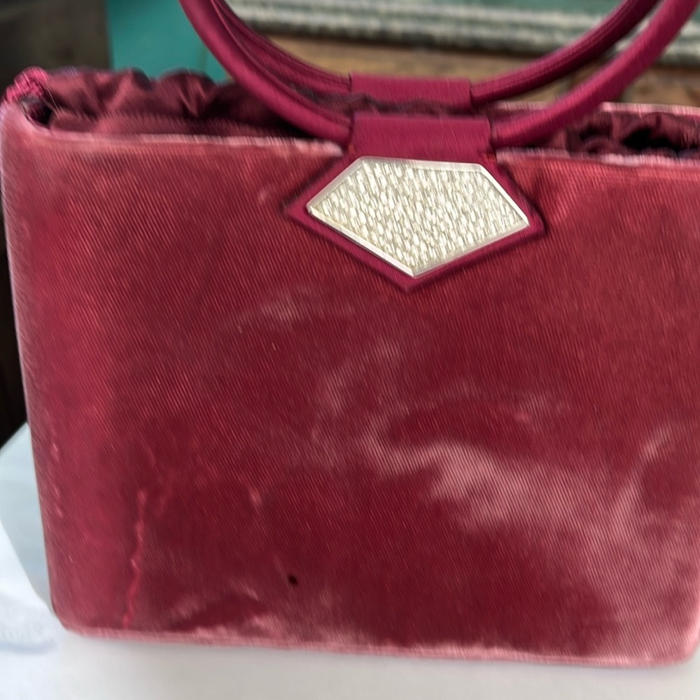 Judith Leiber raspberry velvet evening bag.